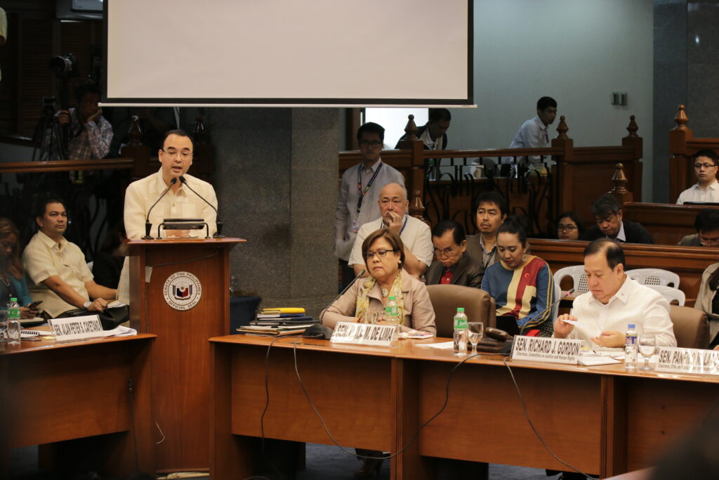 Alan Peter Cayetano speaks at a Senate hearing, addressing colleagues like De Lima & Gordon, discussing policy matters, and leading debate.